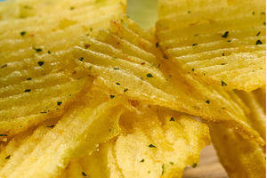 Crispy flavorful chips stacked high, a Food & Drink Photo by darksoul72