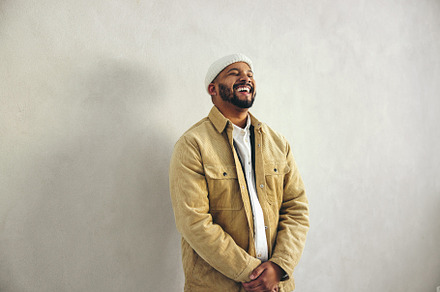 Modern businessman laughing happily in an office, a Person Photo by Jacob Lund