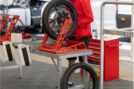 A Man Repairing a Tire on a Cart, a Transportation Photo by Barcelona_dreams