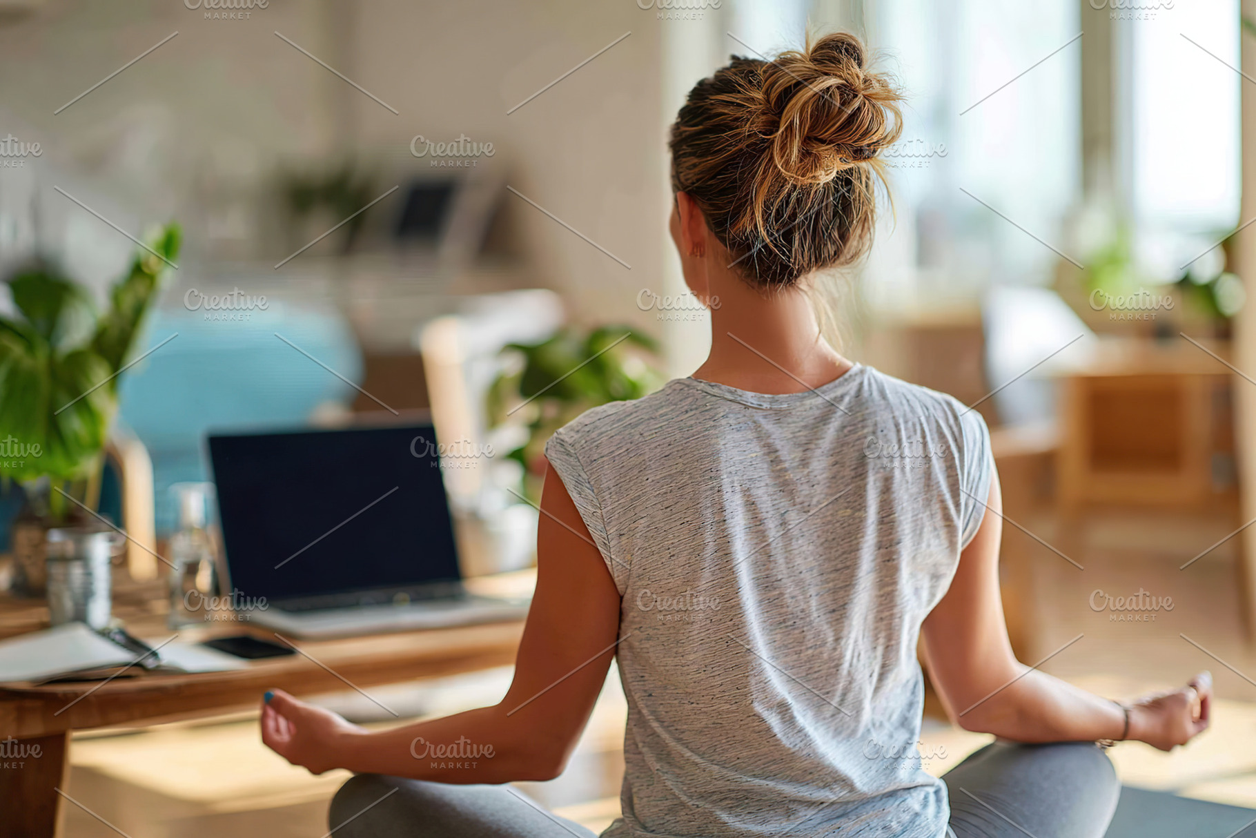 Worker practices yoga to relieve stress during breaks in a bright and airy work, a Photo by AlyaAnd