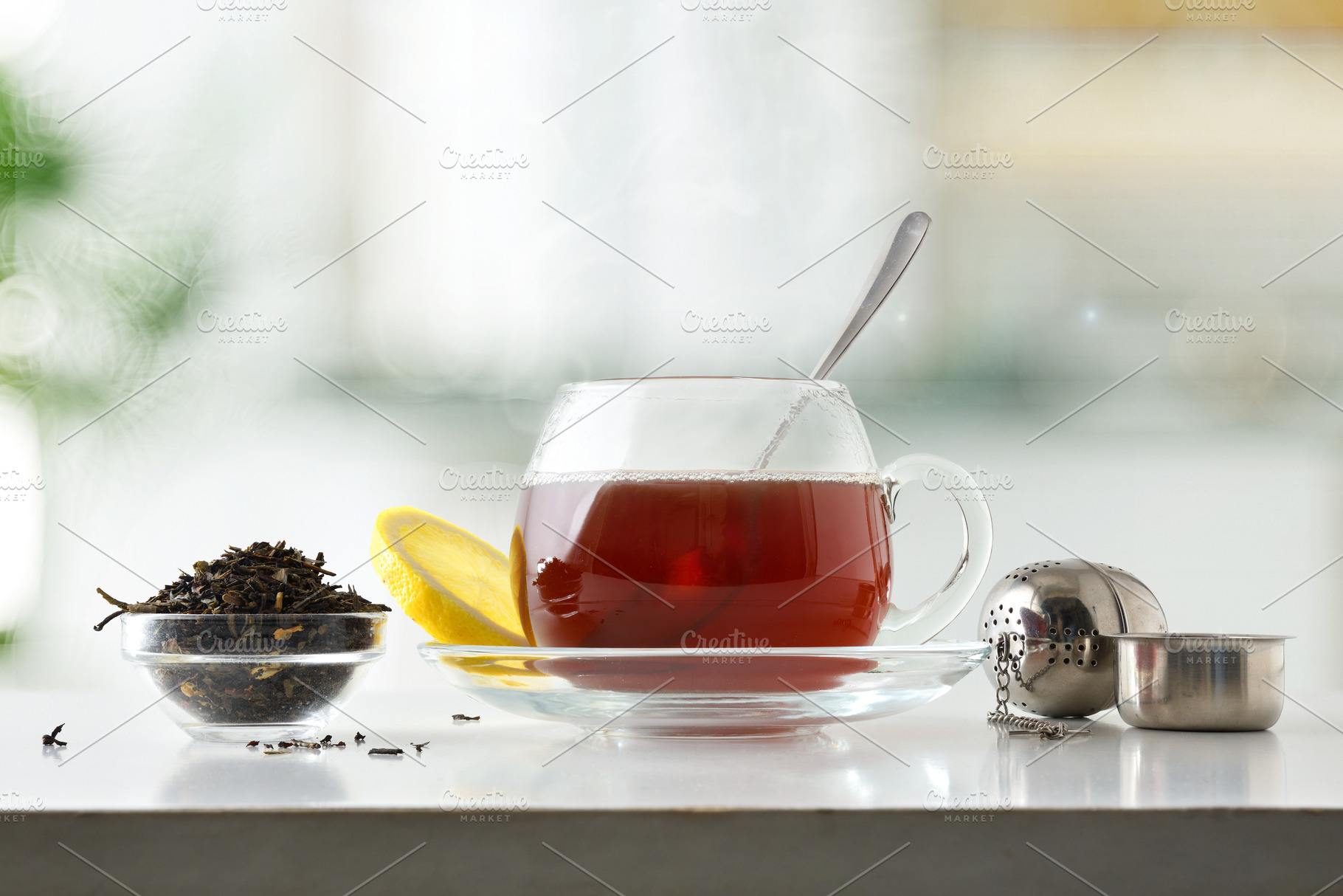 Glass teacup on a saucer on a white kitchen counter, a Food & Drink Photo by Davizro's Market