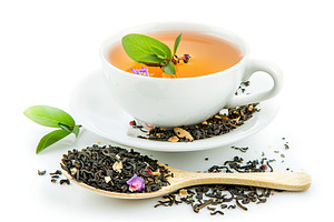 White cup of aromatic tea on white background, a Food & Drink Photo by AlyaAnd