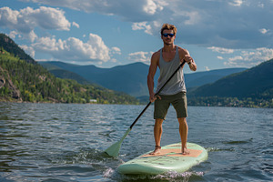 Man Paddle Boarding on Calm Lake Stu, a Photo by Pixeness Studio
