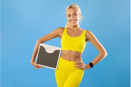Portrait of Sporty Woman Holding, a Person Photo by Prostock-Studio