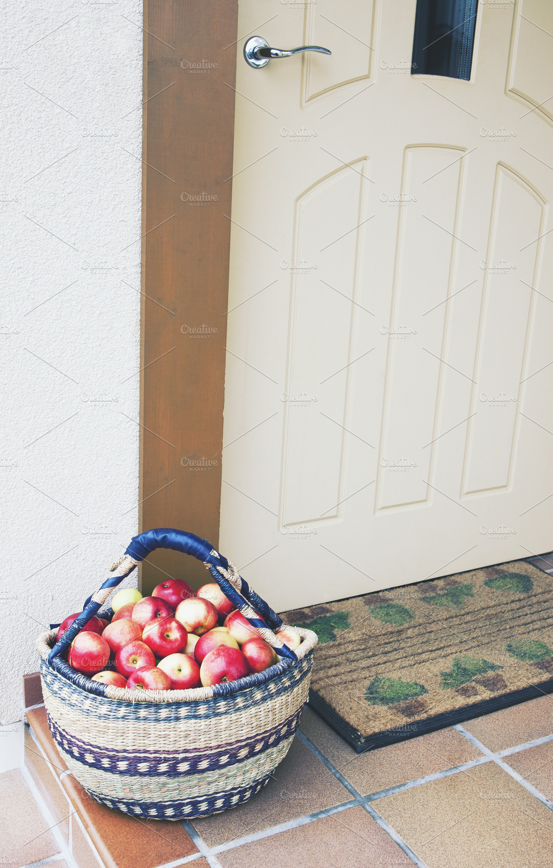 Basket of fresh apples at doorway, a Food & Drink Photo by BOOCYS