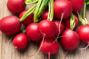 Fresh radishes bunch on rustic wooden table, a Food & Drink Photo by Olena Rudo
