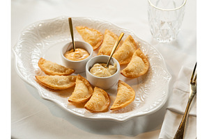 Mini Chebureki with sauces on white, a Food & Drink Photo by Fascinadora