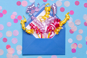 Gift envelope with confetti containing decoration, greeting, and envelope