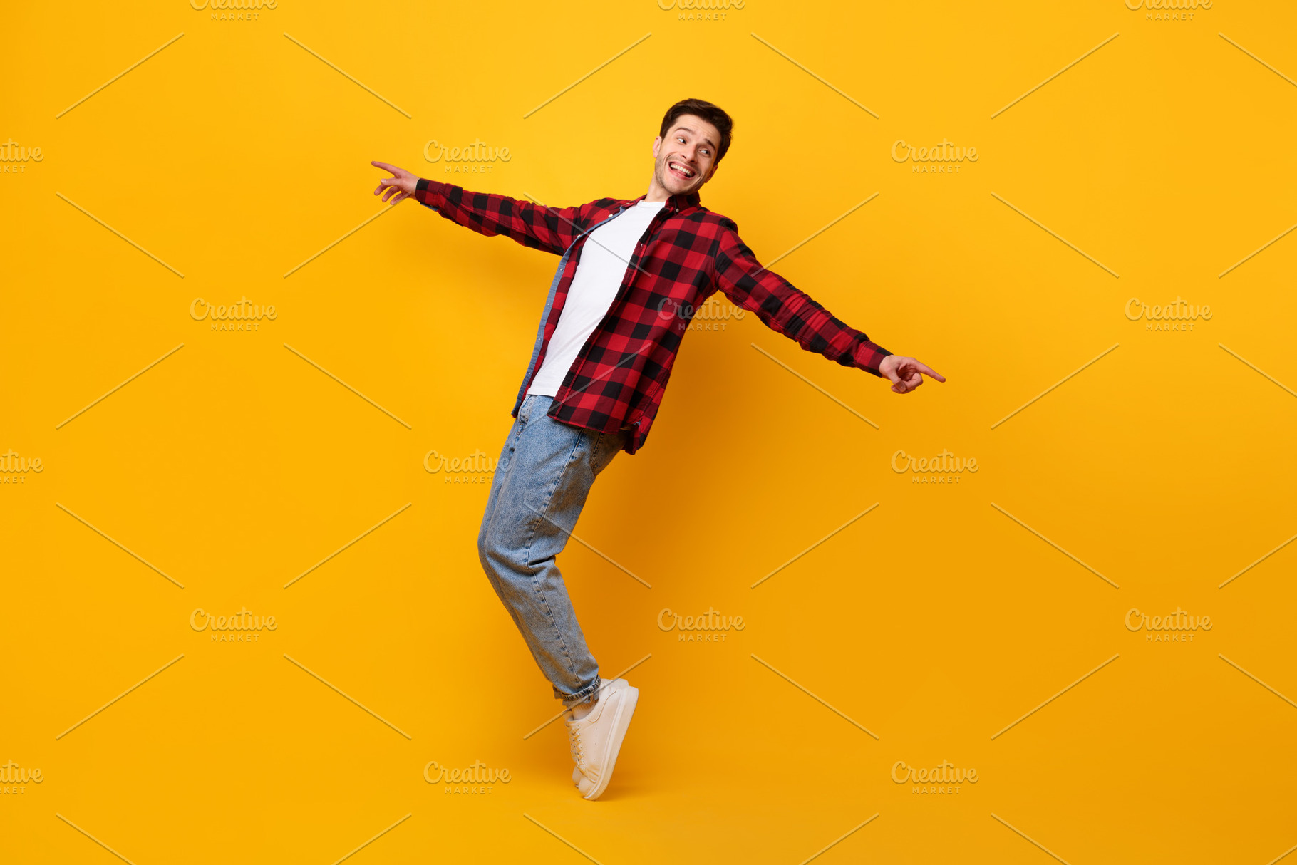 Smiling young man enjoying music dancing disco, a Photo by Prostock-Studio