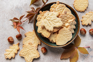 Autumn cookies in bowl with fall leaves and hazelnuts, a Food & Drink Photo by Olena Rudo