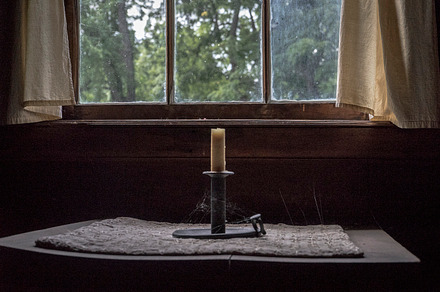 Old Candle in Cabin Window