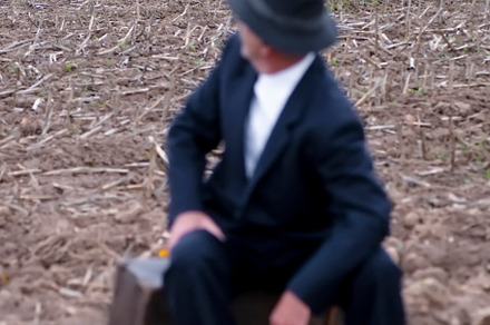emigrant with suitcase and vintage suit leaving his village to l