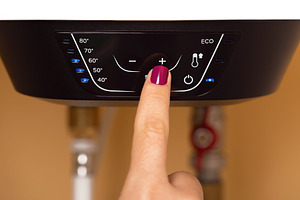 Adjusting Water Heater Temperature, a Technology Photo by Ales Munt