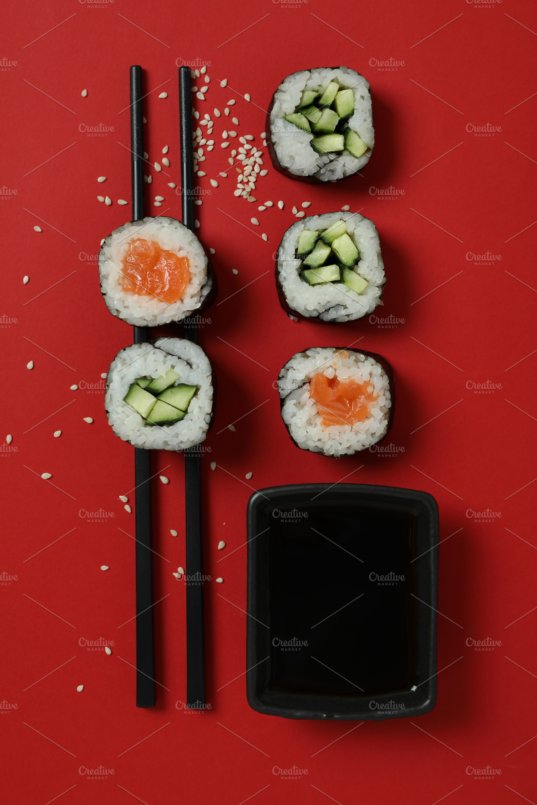 Concept of tasty food with maki on red background, a Food & Drink Photo by AtlasStudio PRO