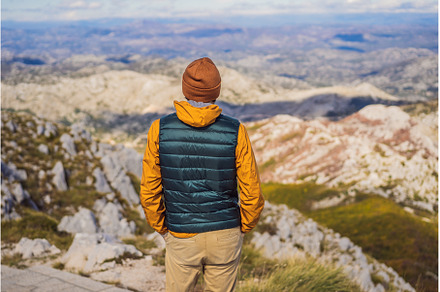 Man traveller in mountain landscape, a Nature Photo by Elizaveta Galitskaya