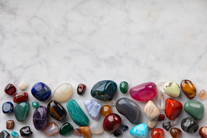 ow of Colorful Polished Gemstones on Marble Surface, an Abstract Photo by Natalia Klenova's Shop