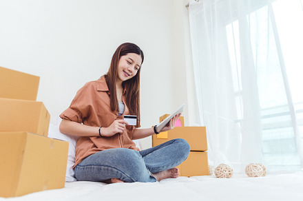 Beauty Asian woman using tablet and credit card. Start up small, a Person Photo by Ministocker