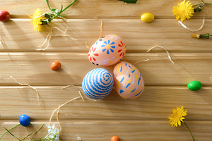 Three Decorative Easter Eggs on Wooden Table, a Holiday Photo by Davizro's Market
