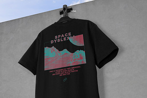 Realistic T-shirt On Wall Mockup