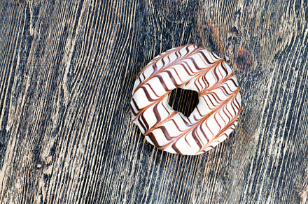 a fresh doughnut covered with white chocolate , closeup, a Food & Drink Photo by MyPhotos