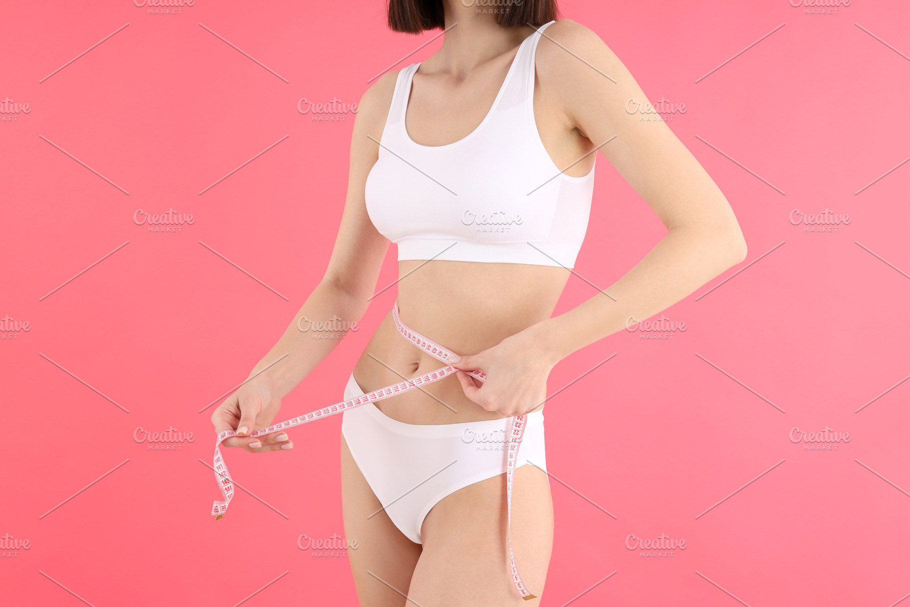 Concept of weight loss with thin girl on pink background, a Person Photo by AtlasStudio PRO
