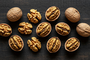 Whole and shelled walnuts arranged o, a Food & Drink Photo by professorinc