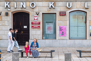 Warsaw, Poland, September 4, 2026, People walking and sitting on, a Photo by Imaginarium