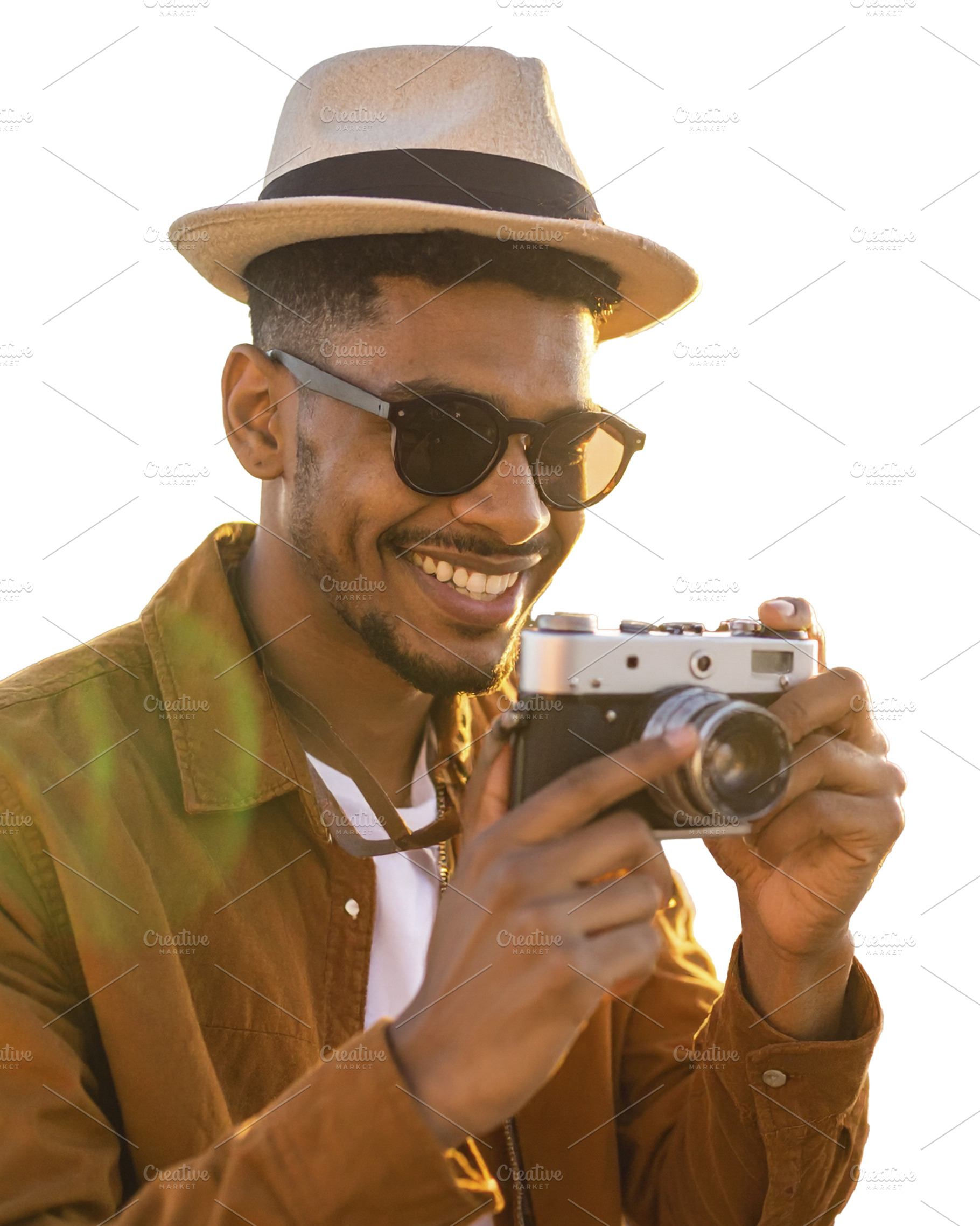 Young man captures memories using a classic film camera isolated, a Person Photo by DanFLCreativo