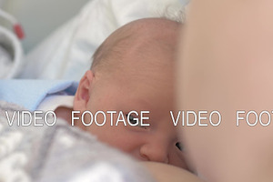 Newborn Baby With Mom Lying Under