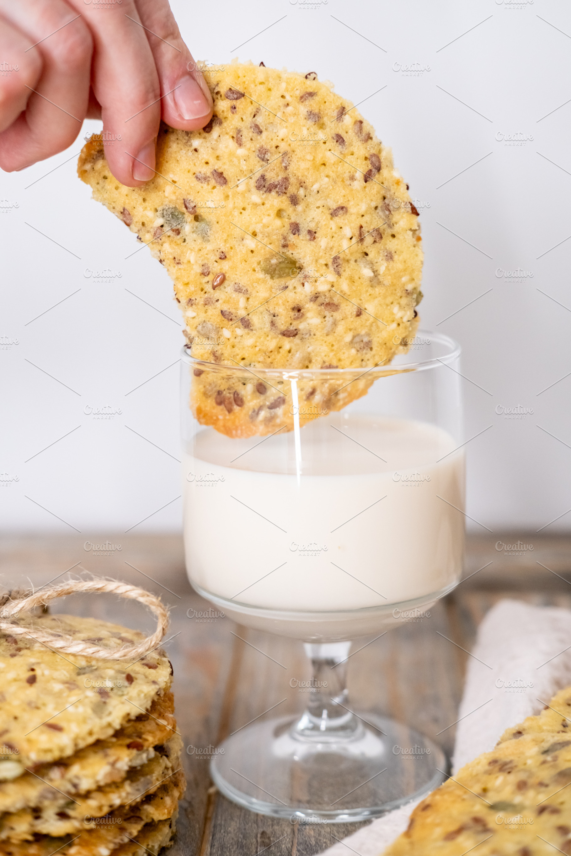 Eating cookies healthy food flax hand yogurt glass, a Person Photo by Photo Drive Studio