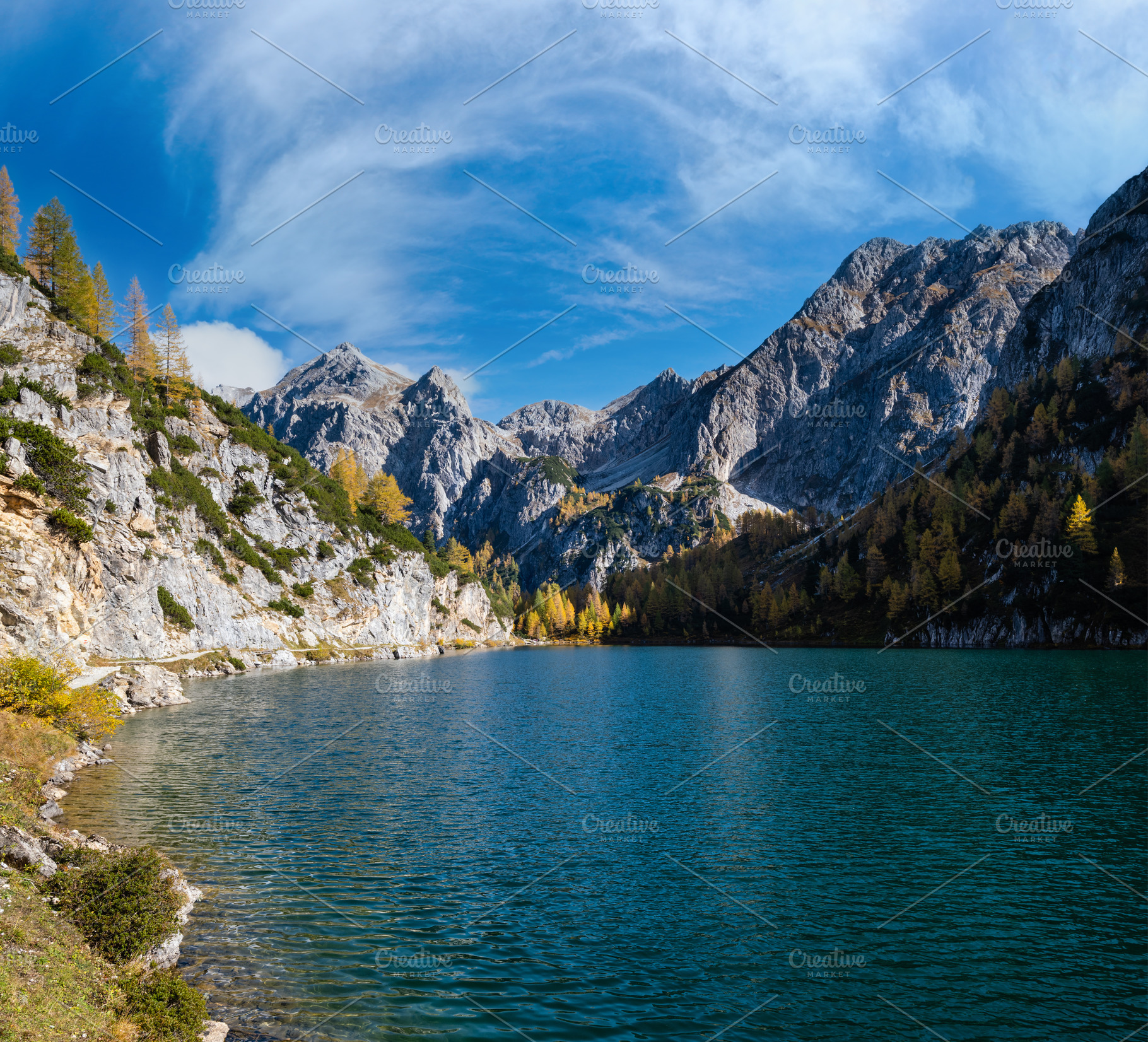 Sunny autumn alpine Tappenkarsee lake and rocky mountains above,, a Nature Photo by YuriyB