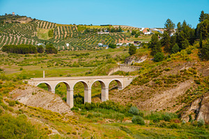 bridge crossing the Priego stream, in Iznajar, a Photo by Nito