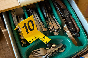 Evidence marker number 10 in kitchen cutlery drawer