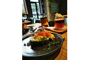 Croissant with salmon, egg, a Food & Drink Photo by sceptical cactus