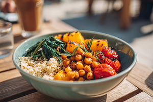 Colorful roasted vegetable bowl with chickpeas and bulgur, a Food & Drink Photo by AlyaAnd