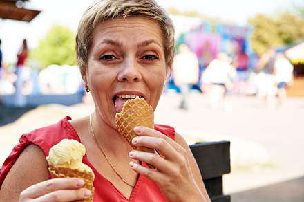 Pretty blond woman with ice cream stock photo containing woman and girl, a Person Photo by HighRes Pictures