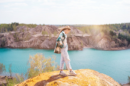 Teen girl on the top of mounting and feeling free, a Person Photo by travnikovstudio