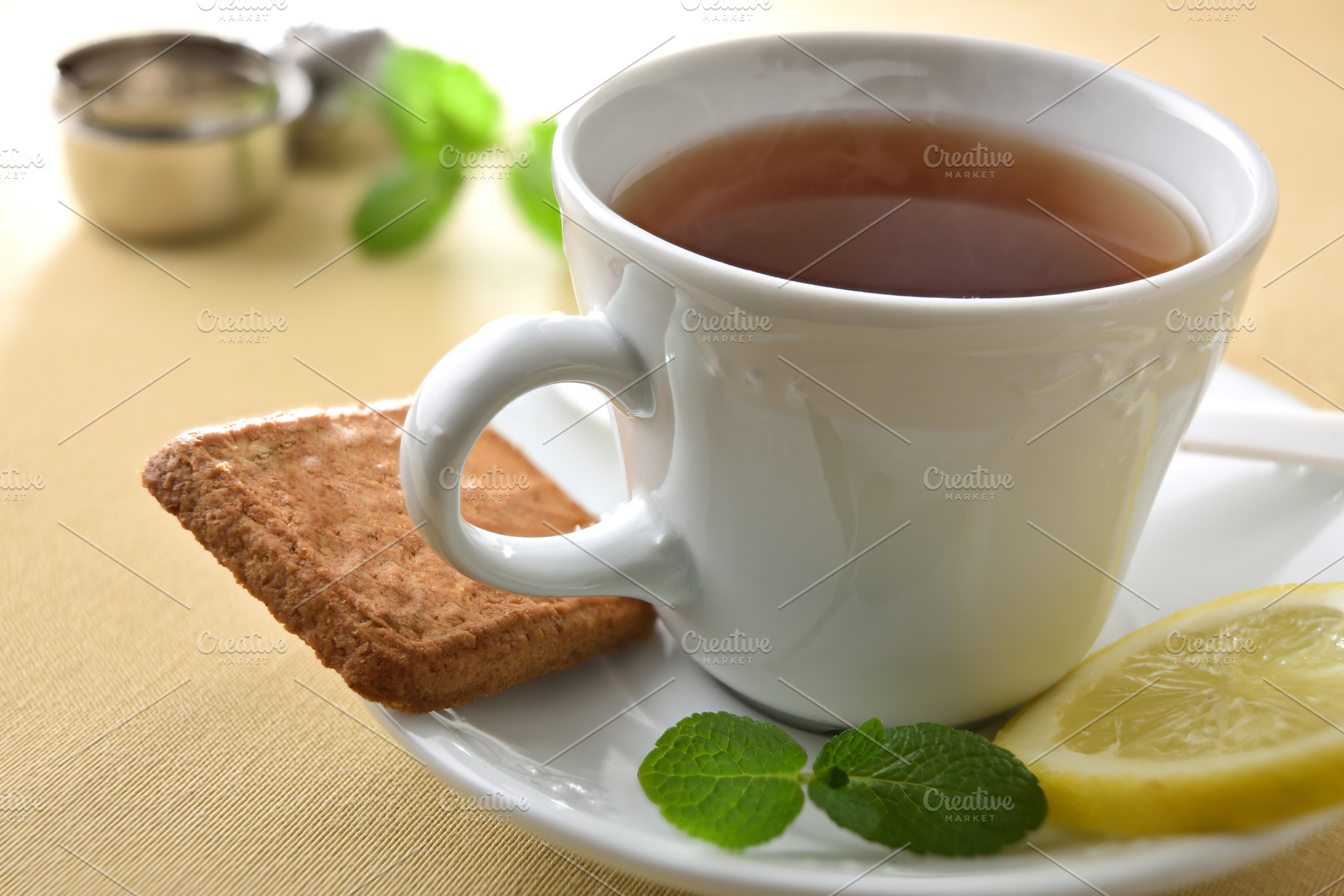 Detail of white ceramic teacup and plate with ingredients, a Food & Drink Photo by Davizro's Market
