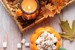 Cozy autumn arrangement with hot chocolate and candles, a Food & Drink Photo by Olena Rudo