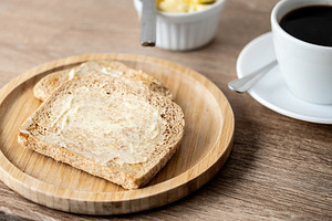 Buttered whole wheat toast with black coffee, a Food & Drink Photo by etorres69