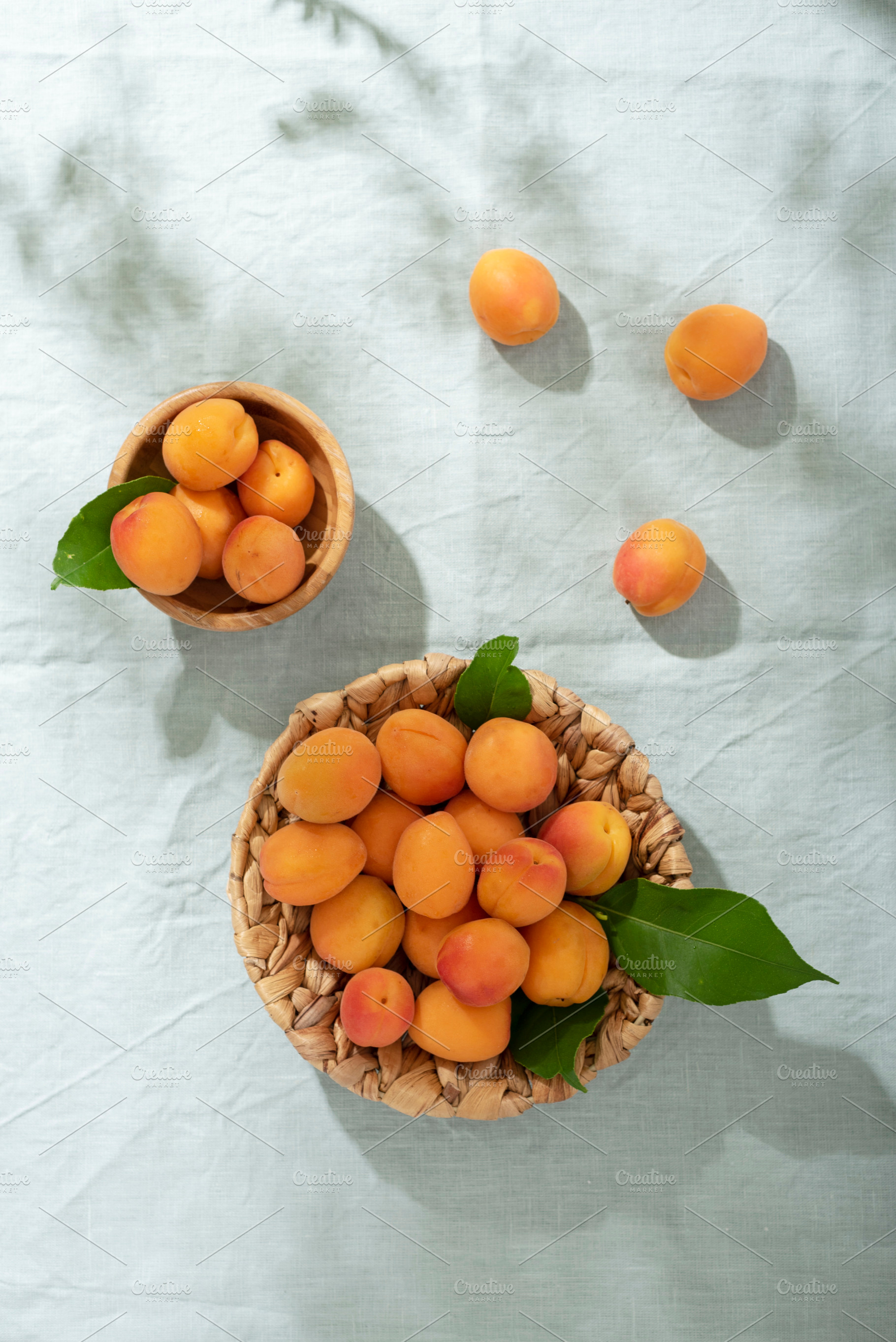 resh apricots on the light green linen tablecloth, a Food & Drink Photo by oxana.denezhkina