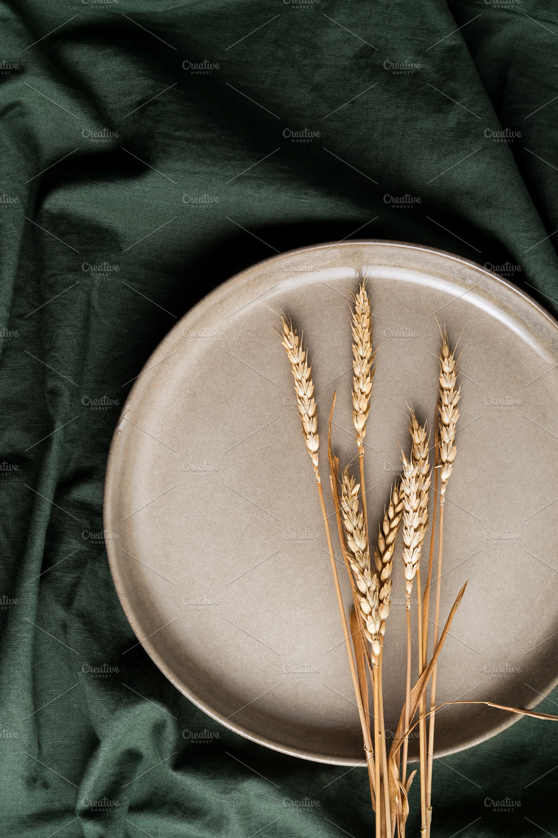 Dry ears of wheat on a beige plate a, a Food & Drink Photo by Edalin's Store