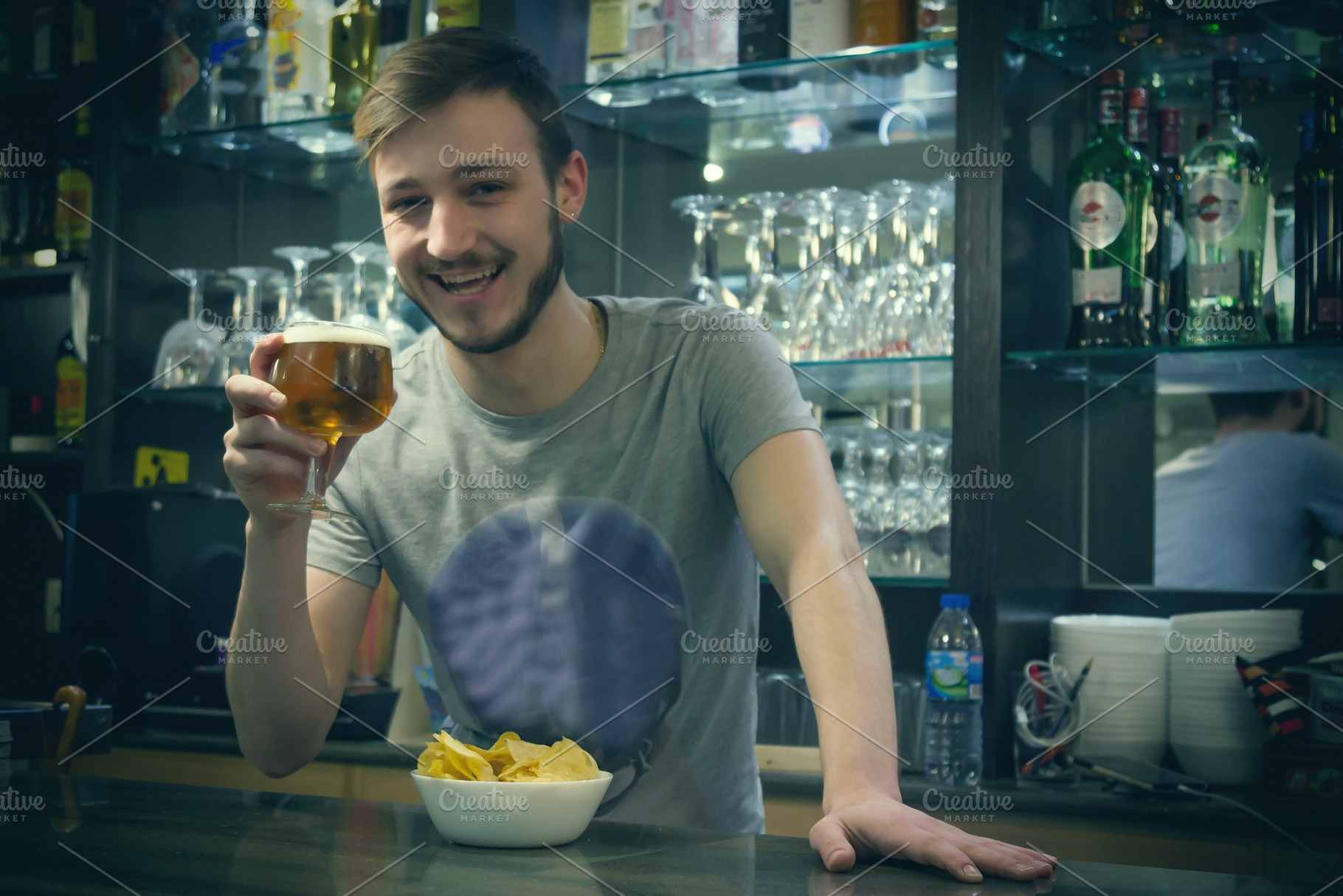 Waiter serving beer in the pub featuring waiter, barman, and pub, a Person Photo by tetxu