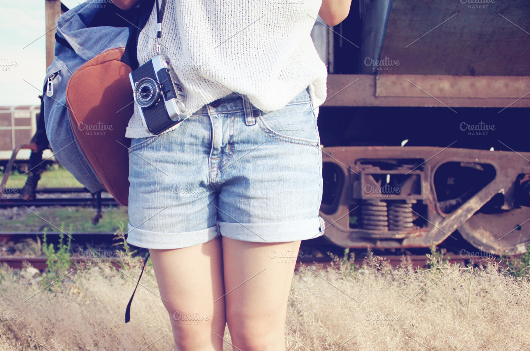 Traveler with bag and film camera