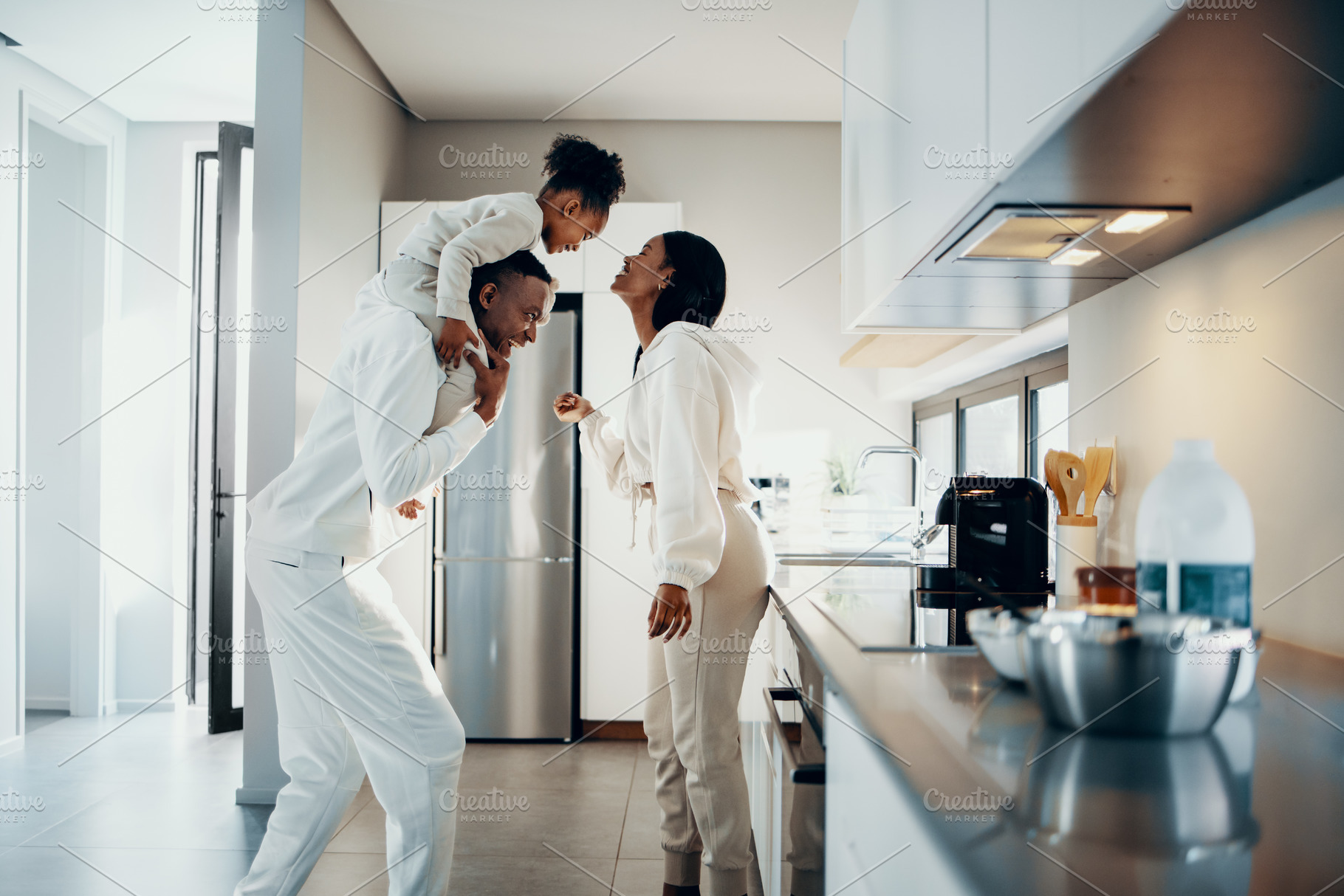 Happy family moments at home, mom and dad are playing with their, a Person Photo by Jacob Lund