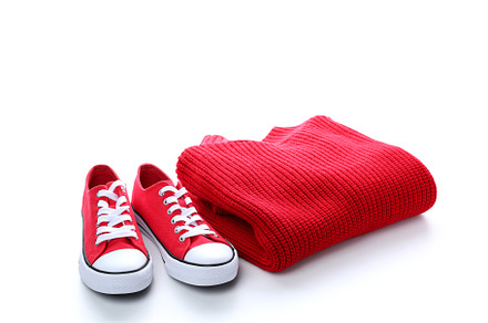 Red sweater and sneakers isolated on white background, a Beauty & Fashion Photo by AtlasStudio PRO