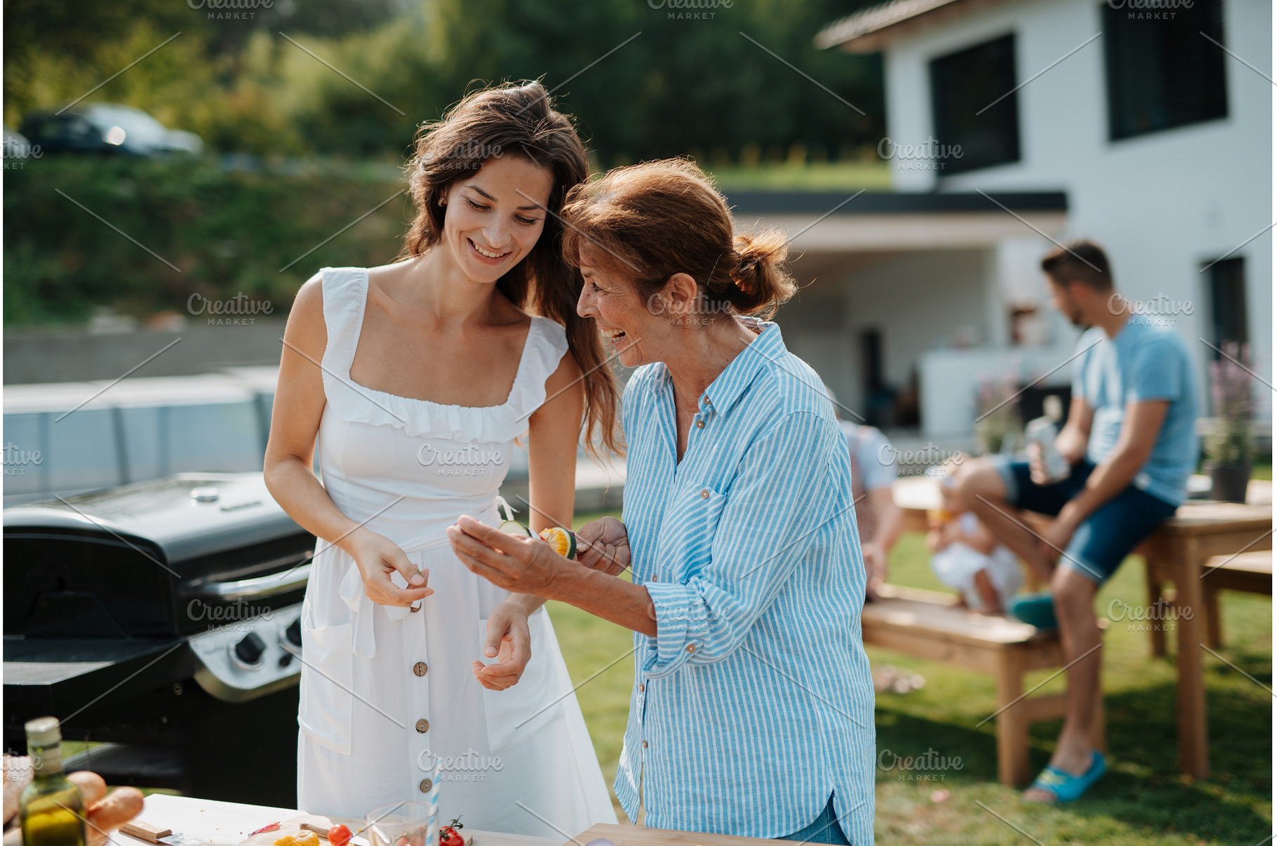 Adult daughter and mother preparing, a Person Photo by HalfPoint