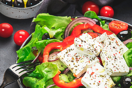Vegetable greek salad with feta cheese, olives, tomatoes, paprik, a Food & Drink Photo by 5PH