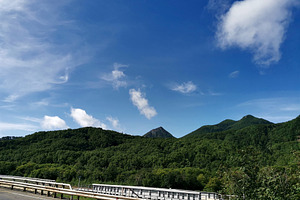 Green mountains under clear sky, a Nature Photo by Elena Vagengeim