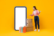 Female Pointing At Huge Cellphone And Cardboard Boxes, Yellow Background, a Photo by Prostock-Studio (Thumbnail 2 of 2)